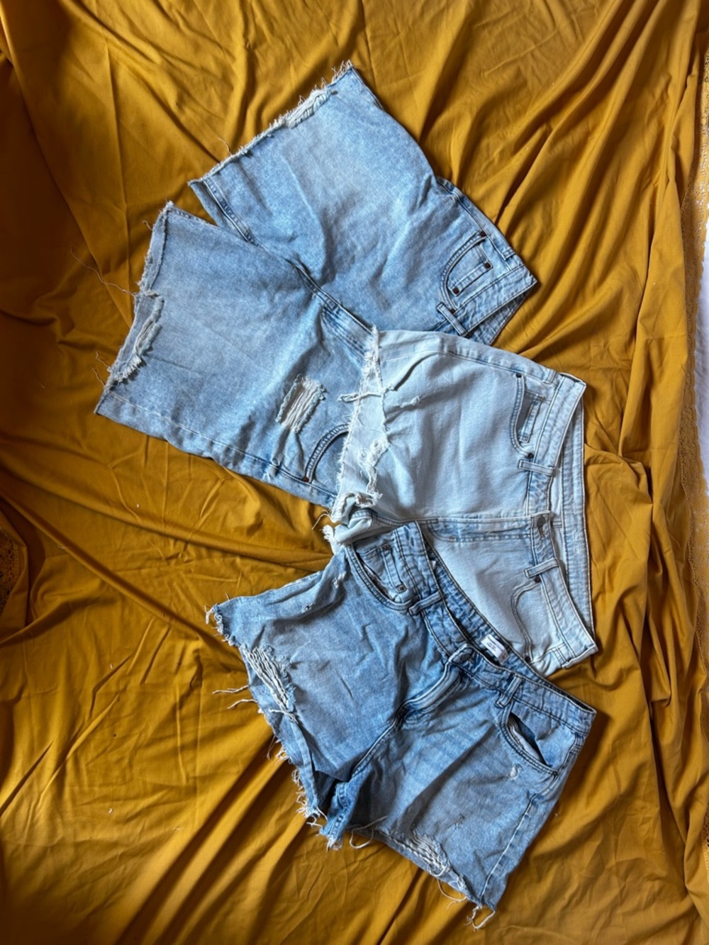 Three Pairs of Light Wash Distressed Denim Shorts